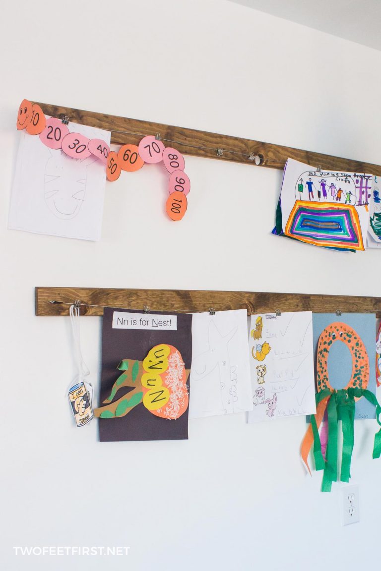 Ideas to display your kids' holiday artwork around the home featuring hanging drawings from clipboards