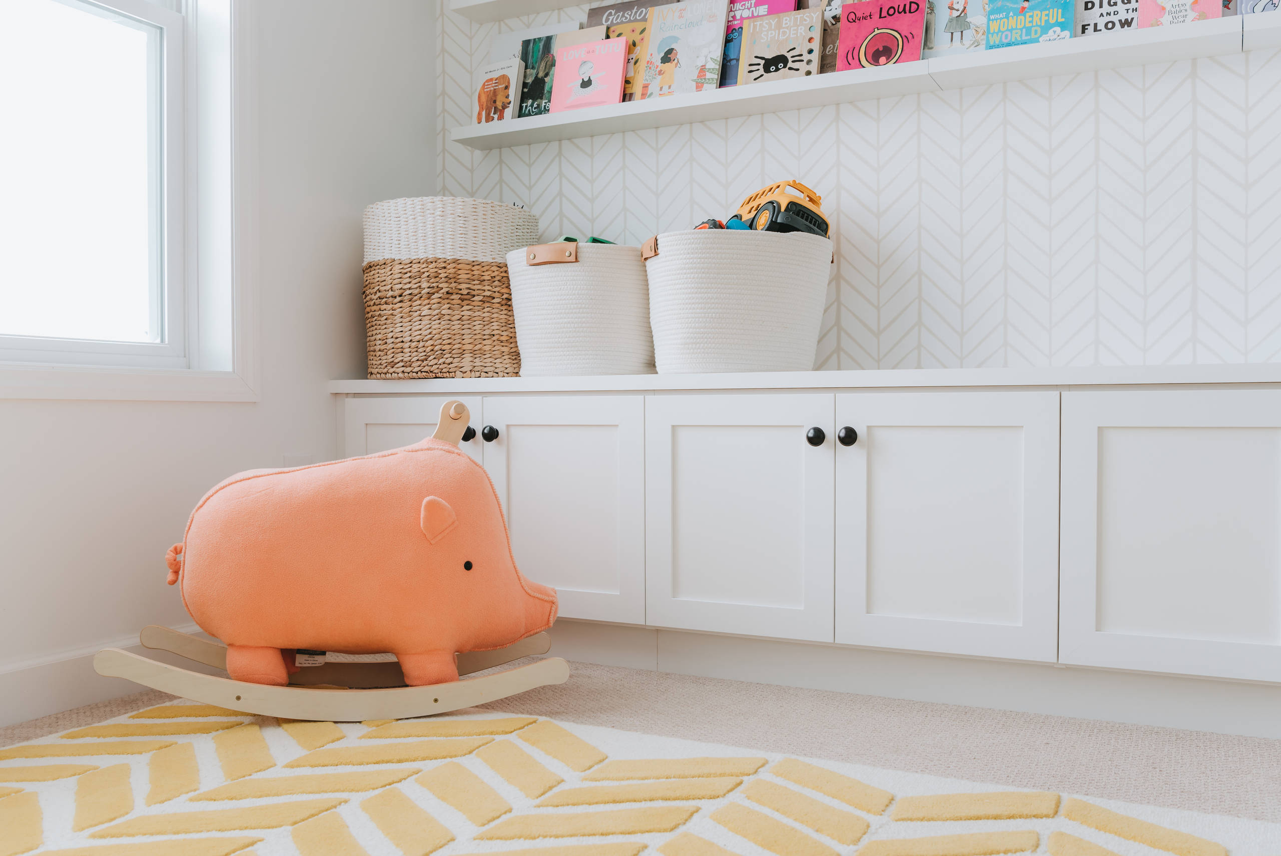 Declutter before new year idea featuring child's room with toy boxes