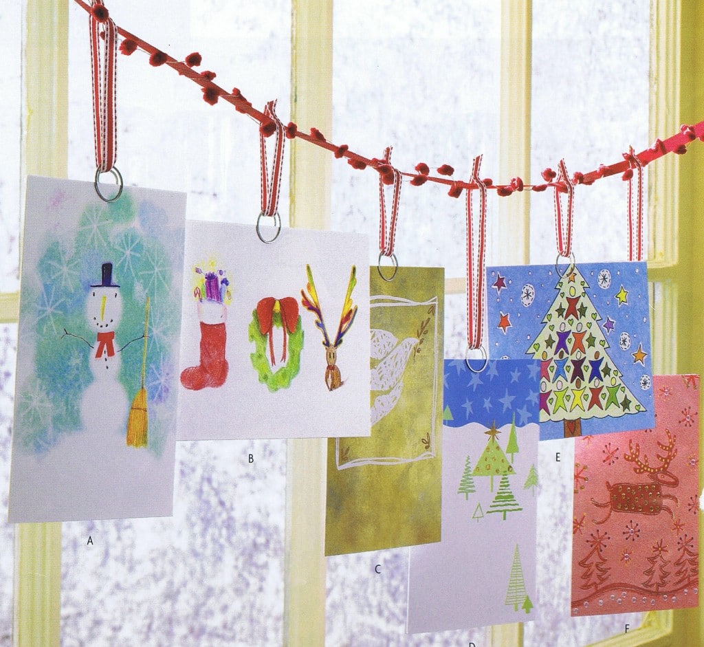 Ideas to display your kids' holiday artwork around the home featuring hanging drawings from string