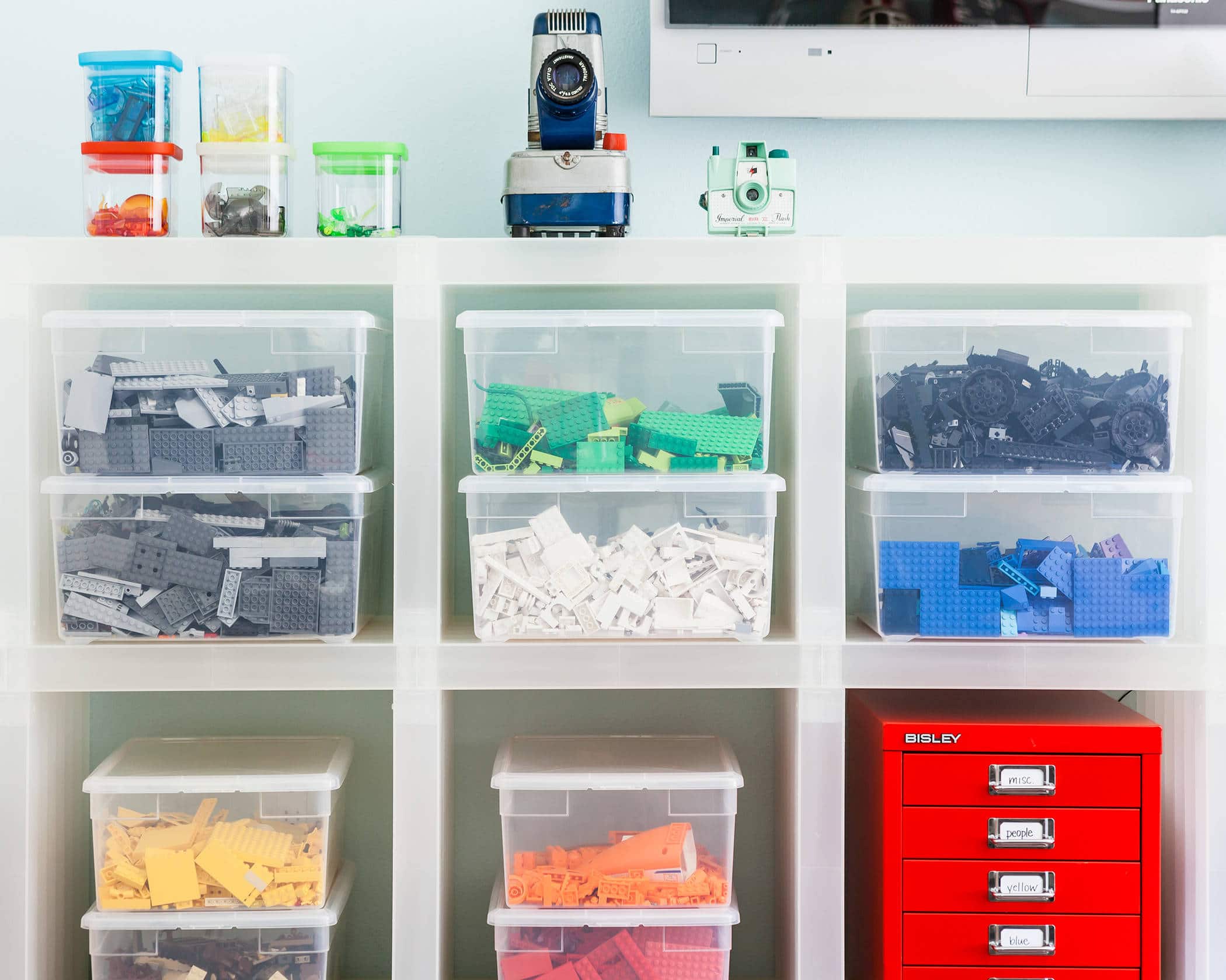 Declutter before new year idea featuring child's room with toy boxes