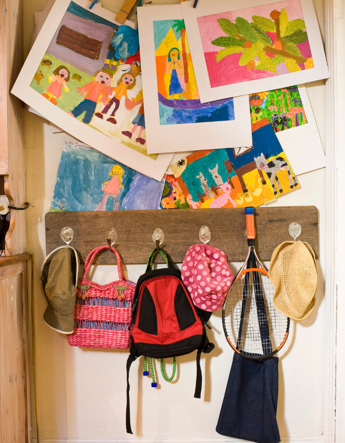 Ideas to display your kids' holiday artwork around the home featuring gallery wall in entryway