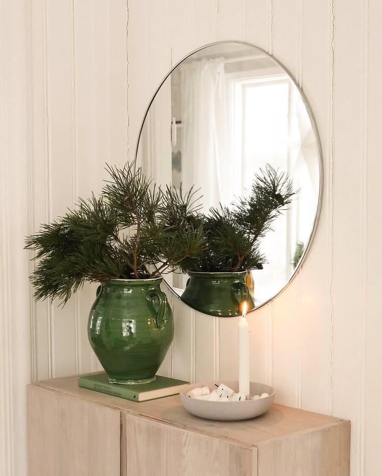 Decorating after Christmas idea featuring a minimalist entryway with winter decor