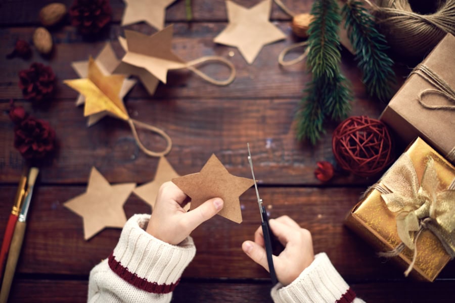 family Christmas traditions idea featuring child making crafts
