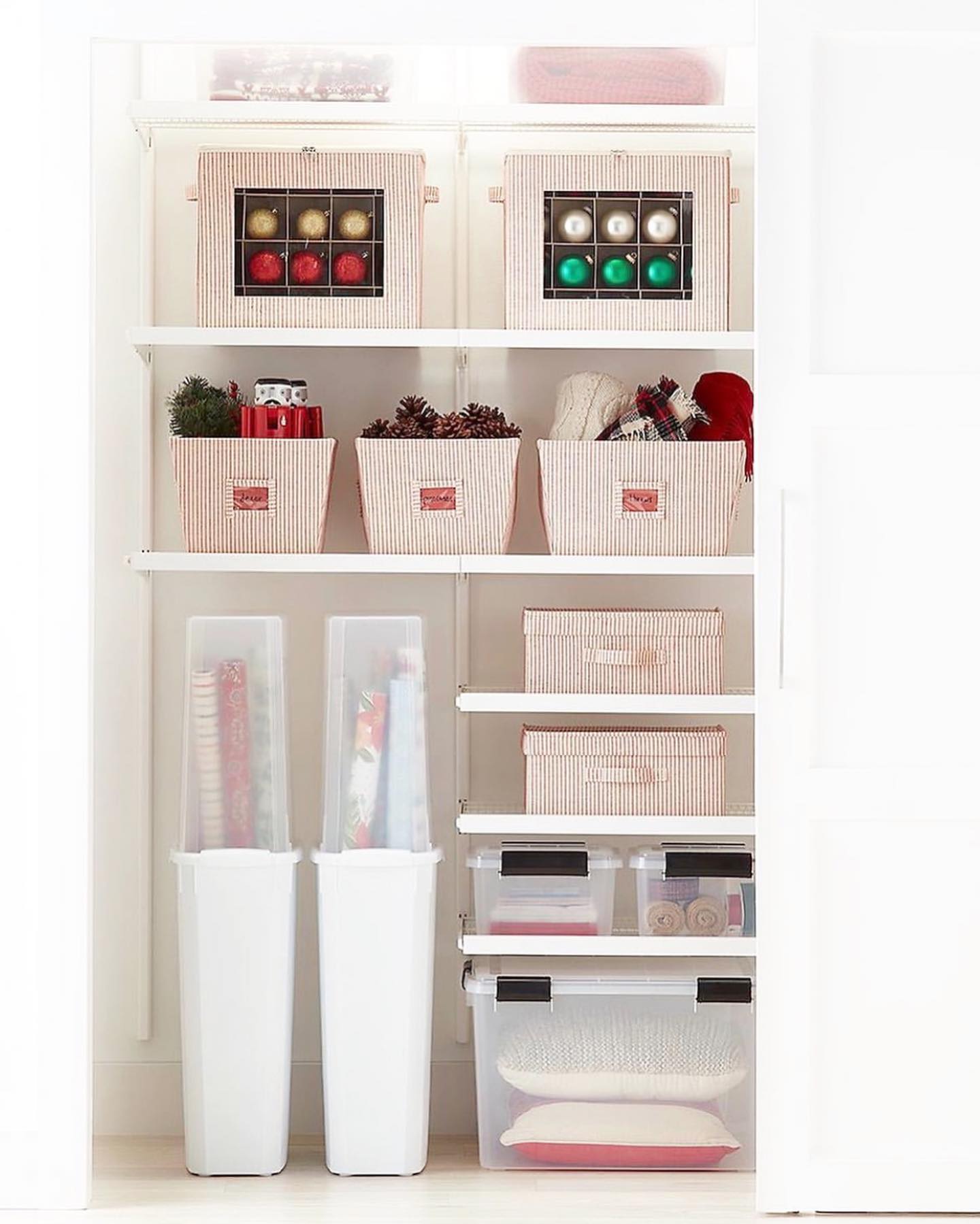 Holiday decor storage ideas featuring a shelving unit with white and red boxes