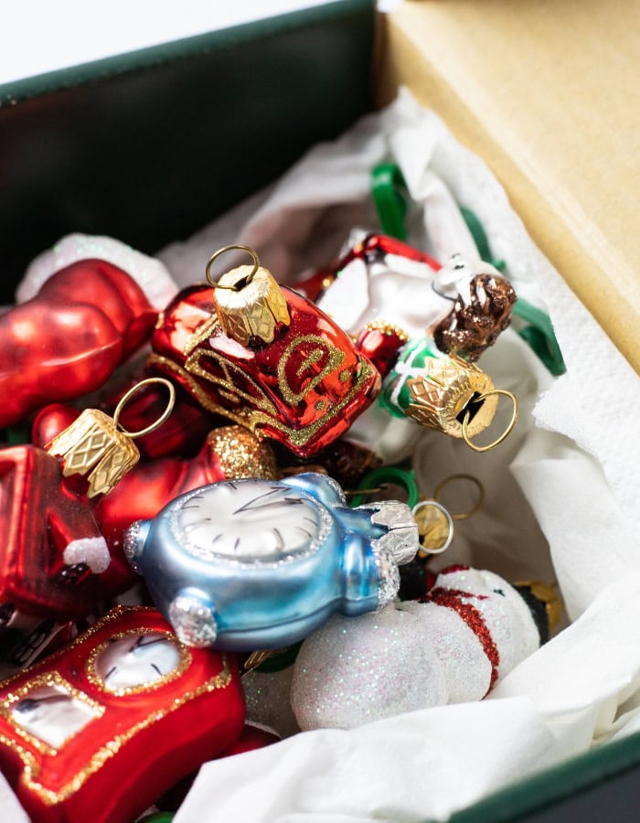 Holiday decor storage ideas featuring a ornaments inside storage boxes