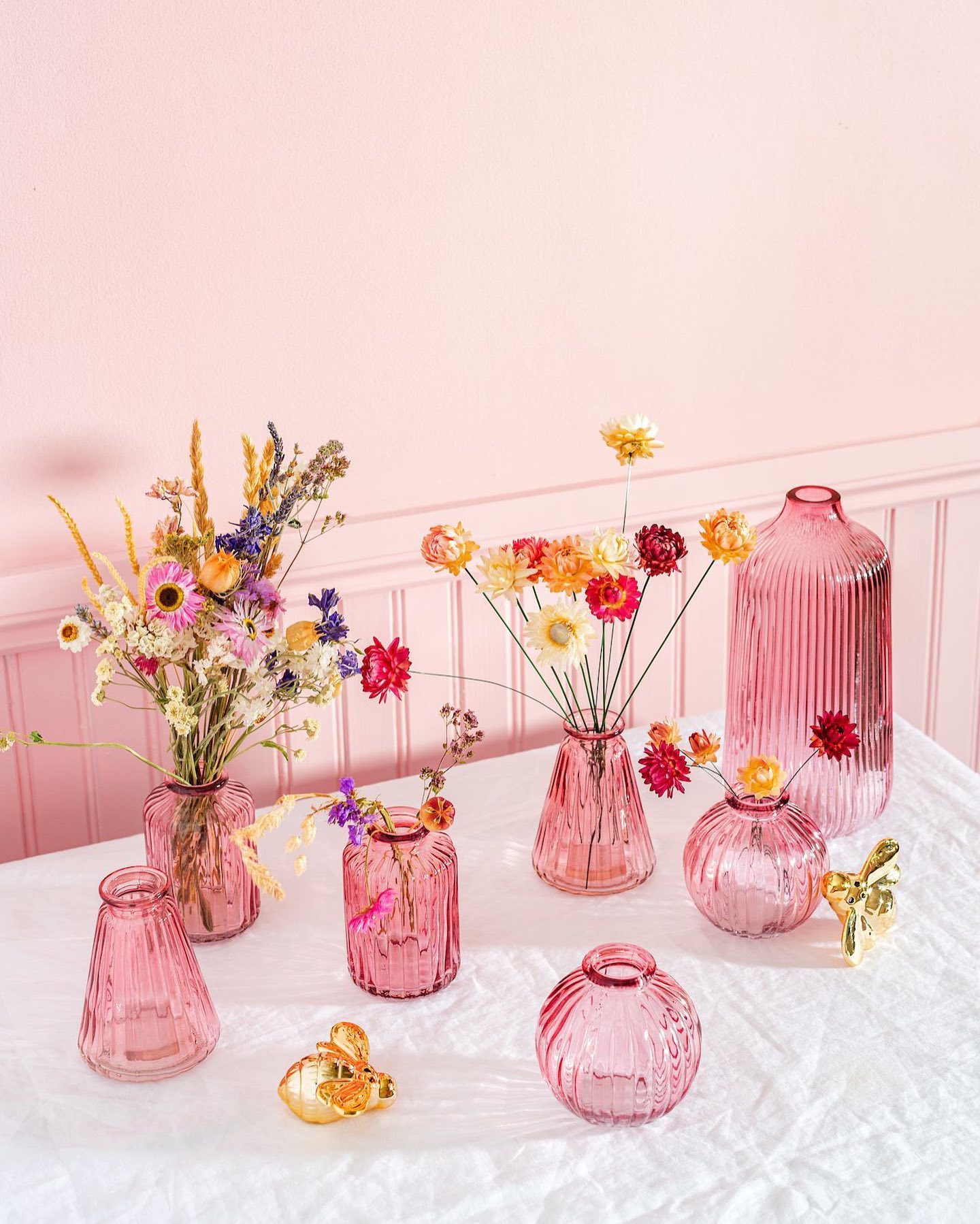 Valentines Day Brunch idea featuring a tablescape with hot glass pink vases