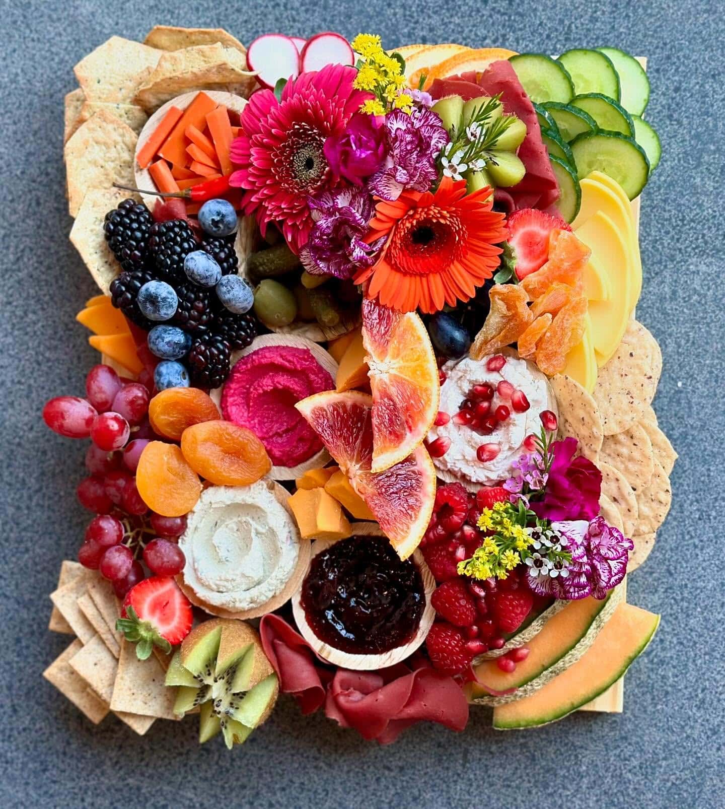 Valentines Day Charcuterie Board ideas and inspiration in red and pink with savory treats, fruits and candy