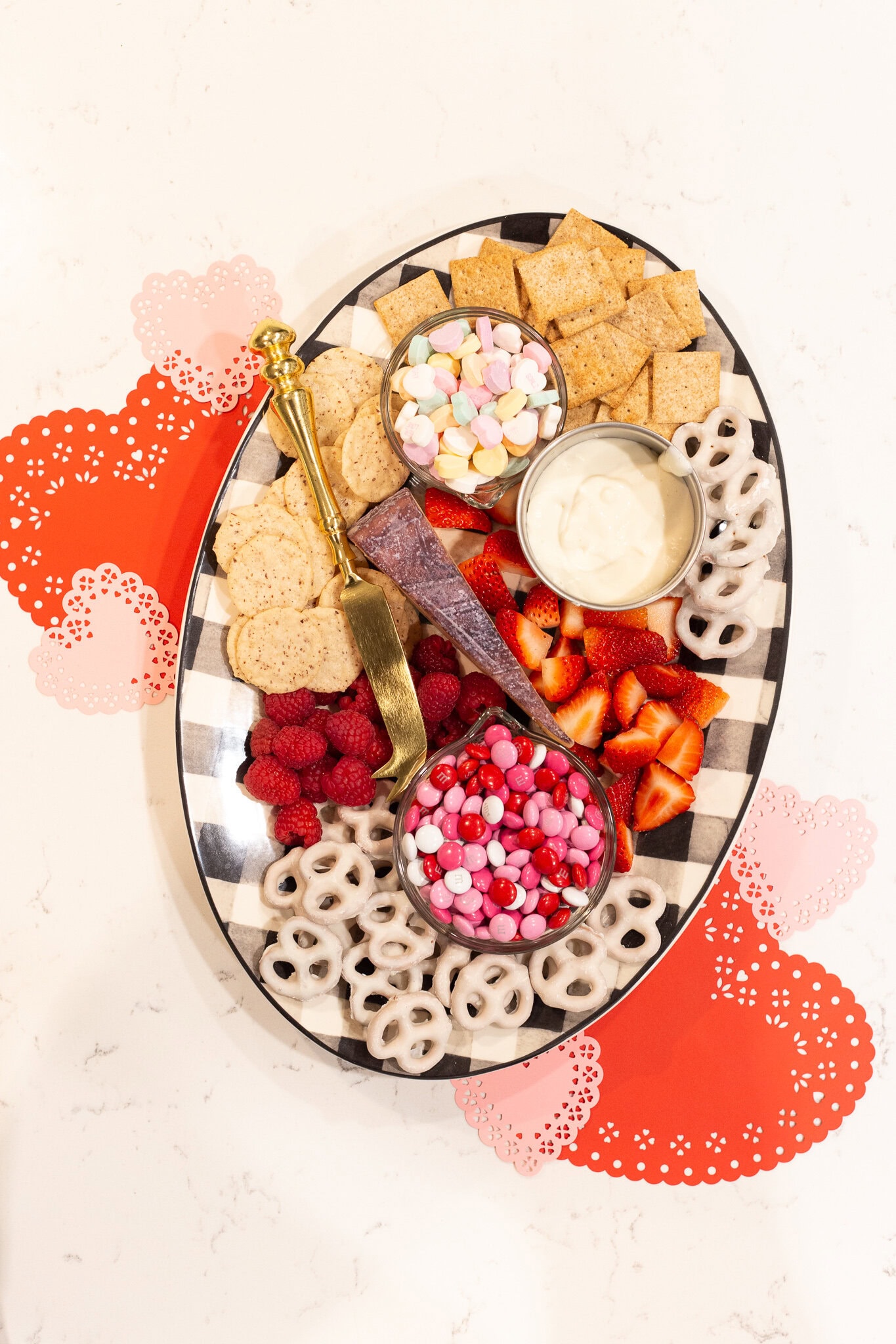 Valentines Day Charcuterie Board ideas and inspiration featuring one with paper heart decor