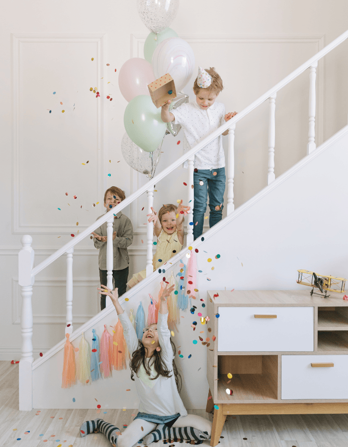 Celebrating New Year's eve with kids featuring a children at home party having fun