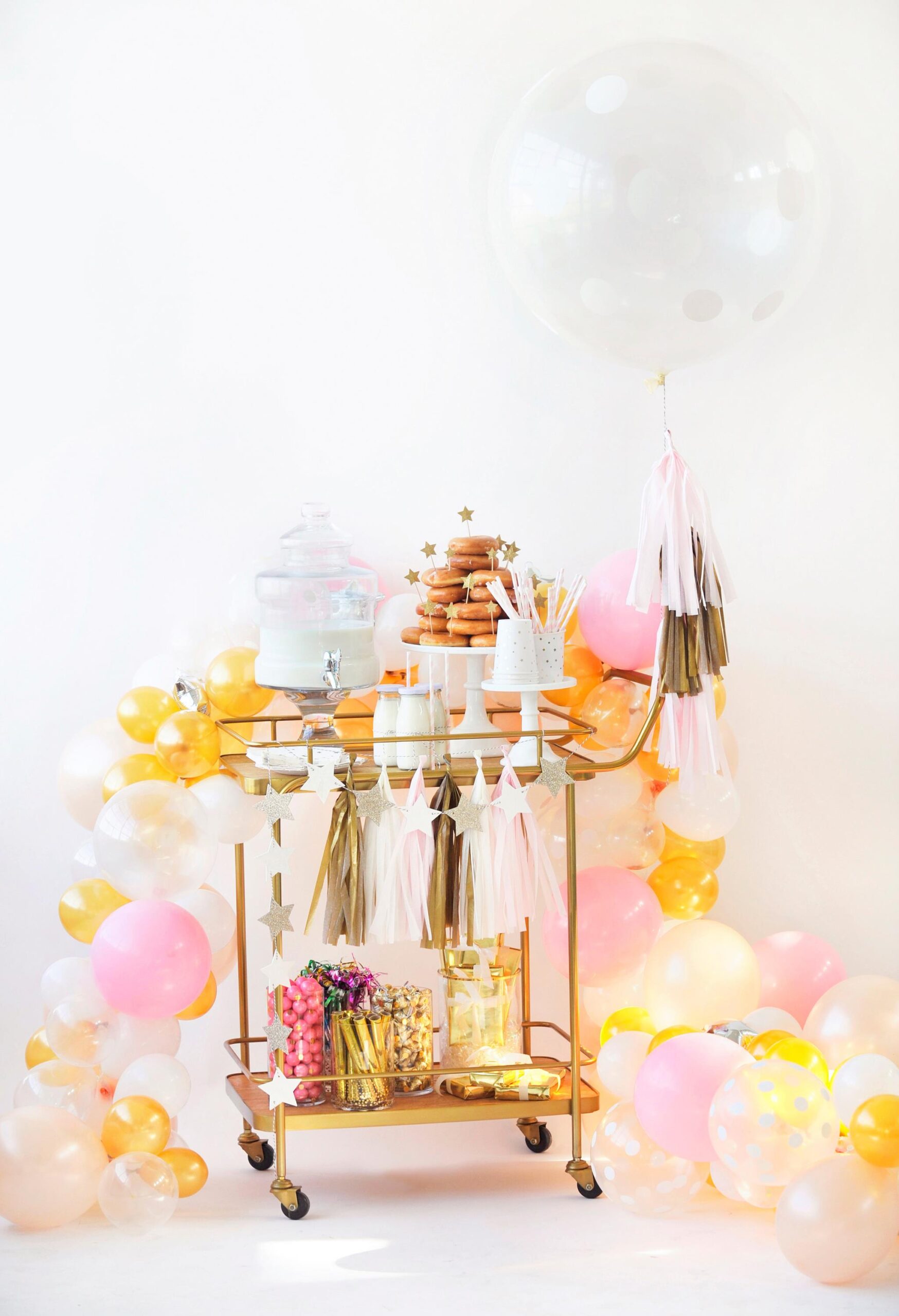 Celebrating New Year's eve with kids featuring a fun snacks bar cart in pastel tones