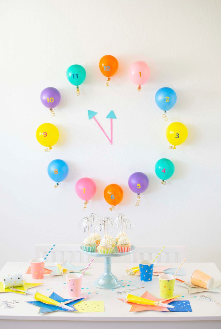Celebrating New Year's eve with kids featuring a colorful Balloon Pop Countdown