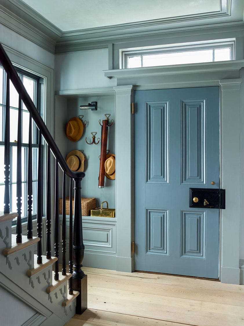 Home design trends 2025 idea featuring a an entryway with color drenching painting technique in blue with traditional style