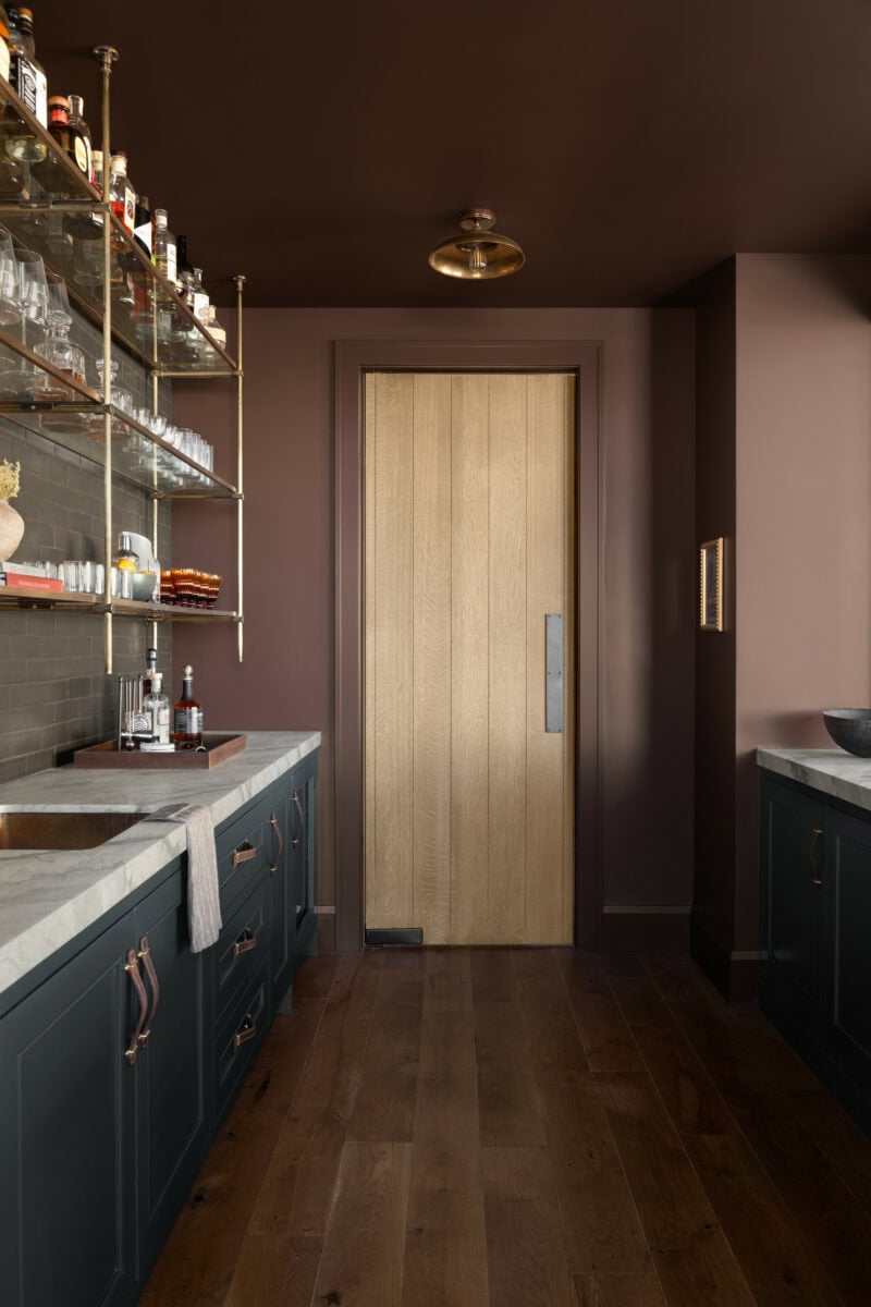Home design trends 2025 idea featuring a pantry with color bocking technique in dark purple and dark blue