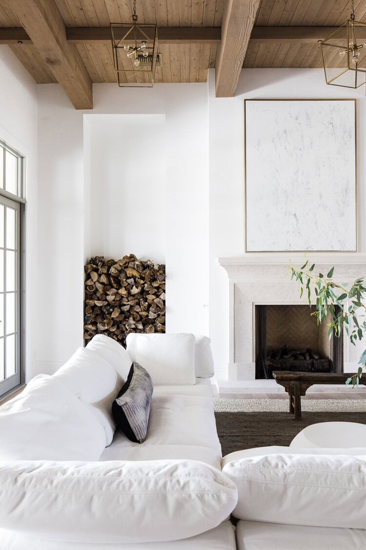 Home design trends 2025 idea featuring a living room with bright white and brown hues palette