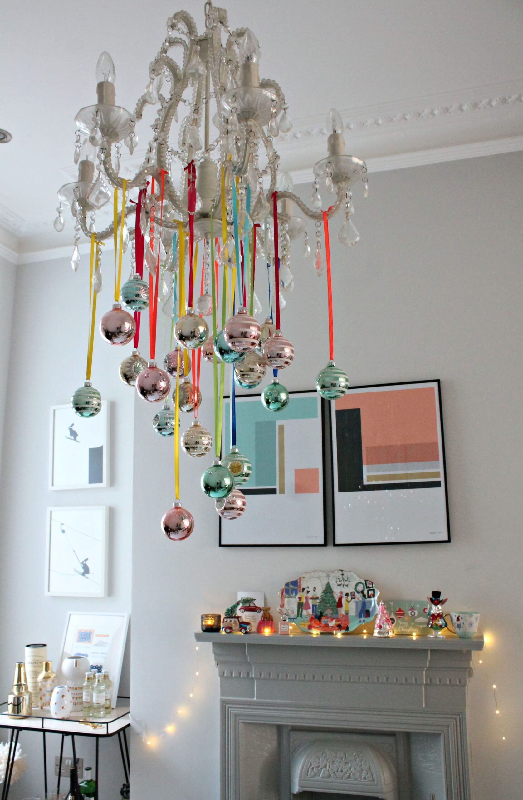 Kid-friendly Christmas party idea featuring a a chandelier with hanging ornaments