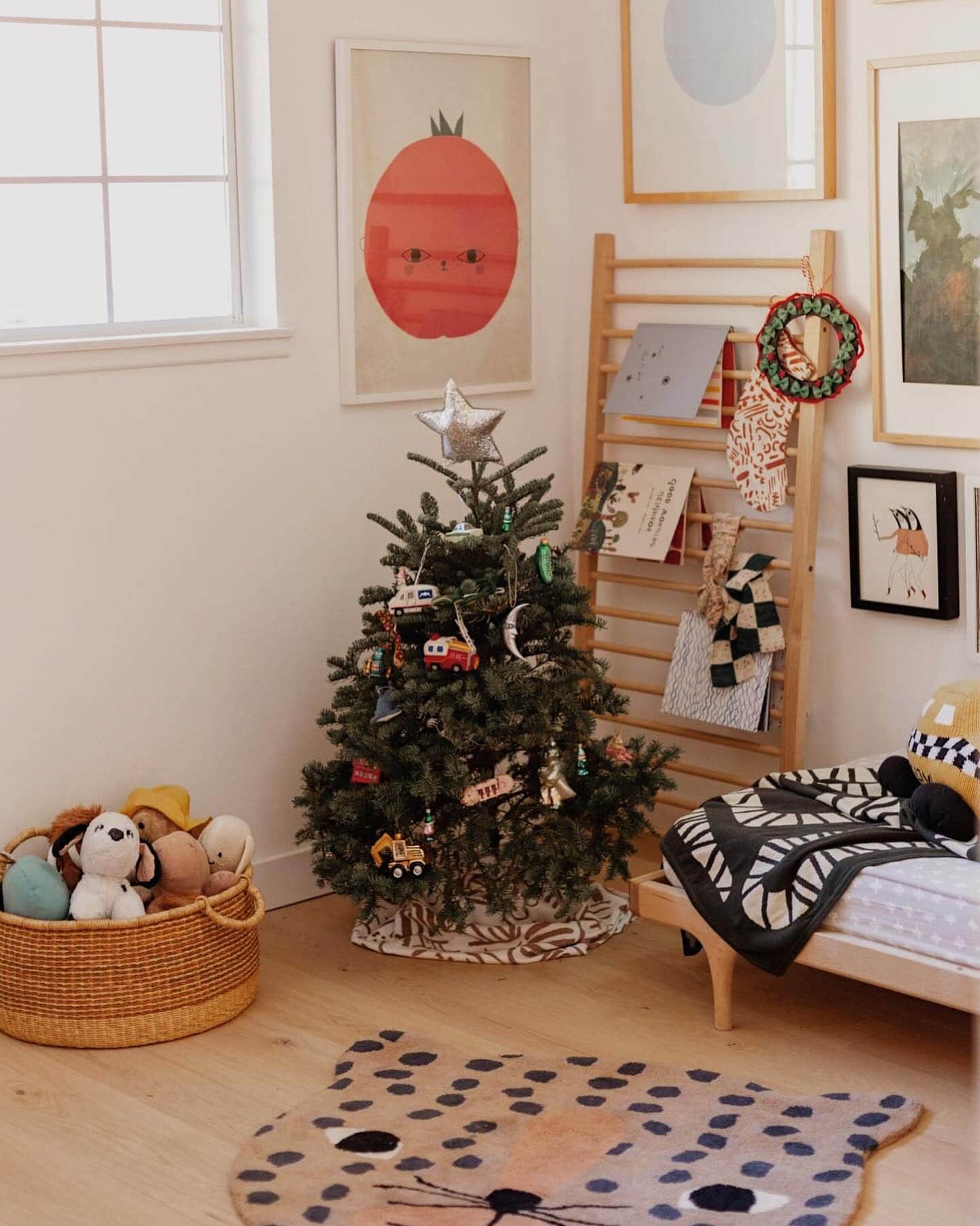 Kid-friendly Christmas party idea featuring a bedroom with soft and tactile christmas decor ornaments