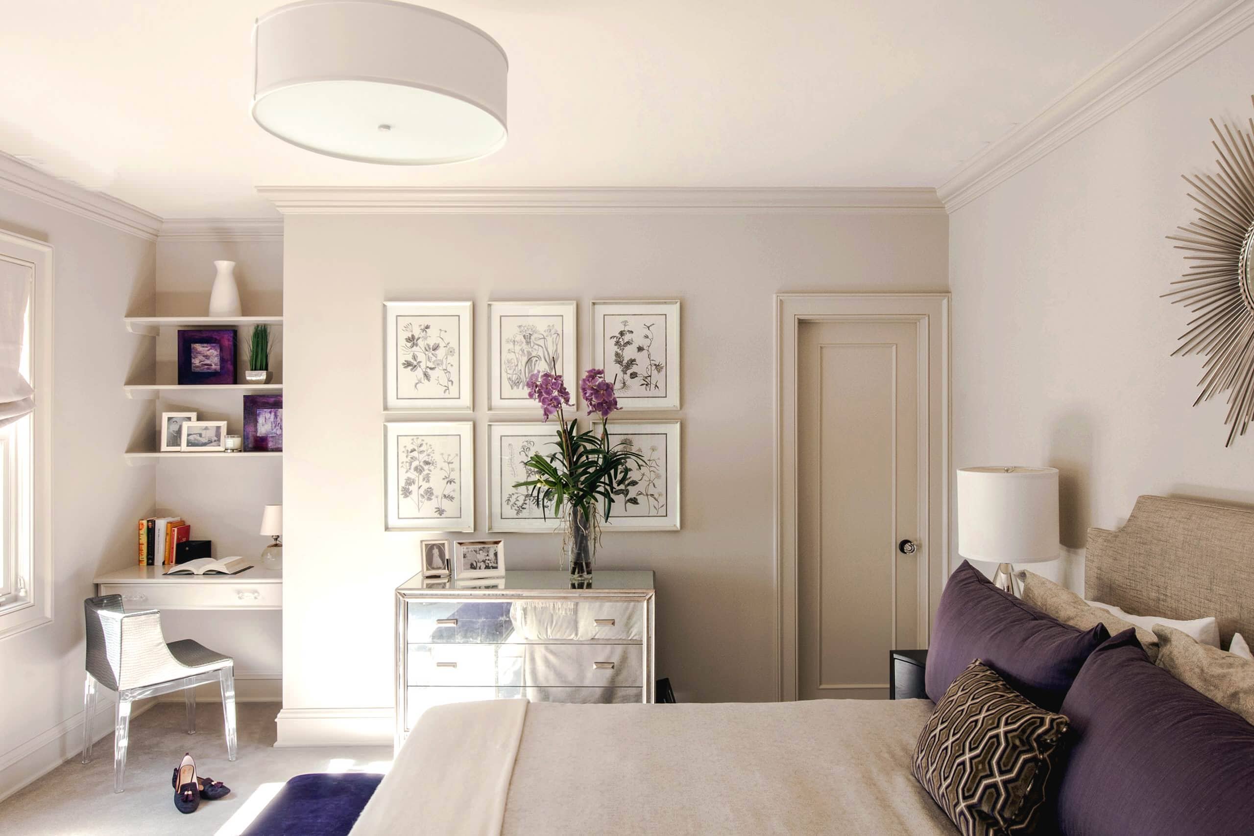 Example of how to use mirrors and lighting to enhance a space featuring a bedroom with mirrored furniture