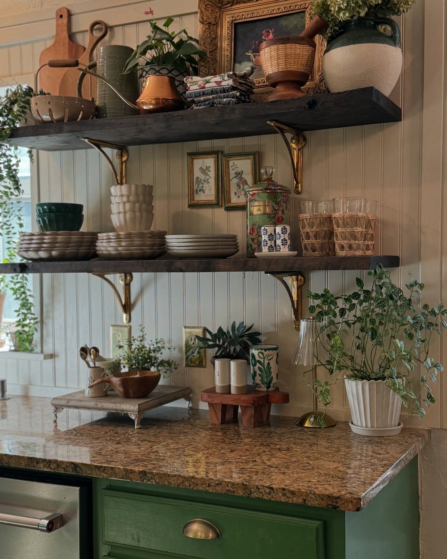 Real-life example of cottage style kitchen decor featuring sage green counters