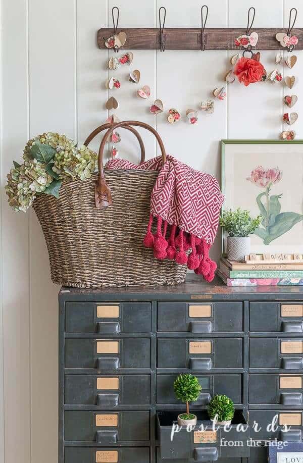 Vintage Valentine's Day decor idea featuring an entryway in romantic style with hearts garland