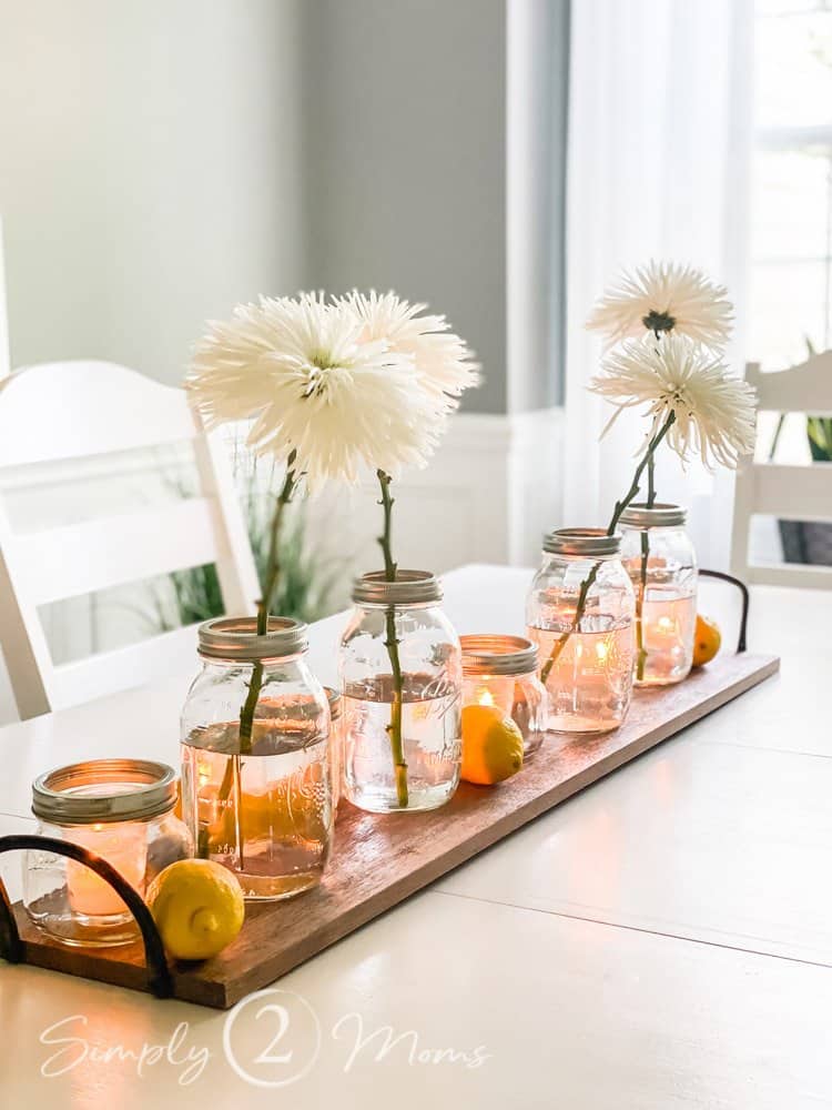 Vintage Valentine's Day decor idea featuring mason jars with white floral arrangements