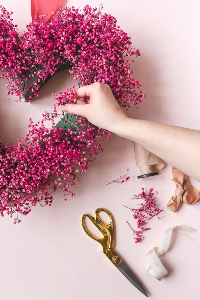 DIY Valentine's Day Decor idea featuring heart-shaped wreath