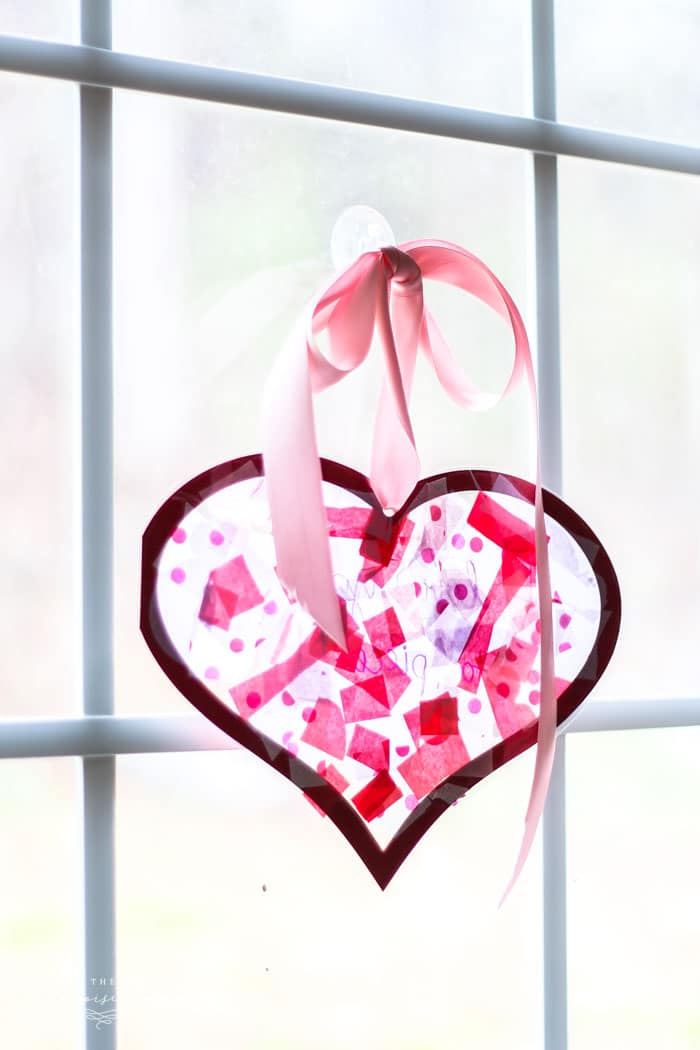 DIY Valentines kid-friendly craft idea featuring hearts-shaped suncatches