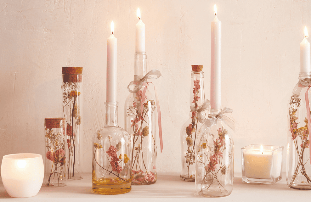 Vintage Valentine's Day decor idea featuring clear vases with pink and white floral arrangements