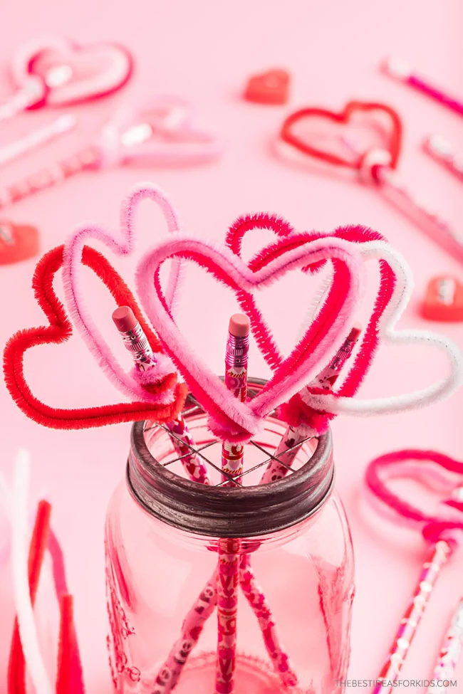 DIY Valentines kid-friendly craft idea featuring pipe cleaner heart toppers
