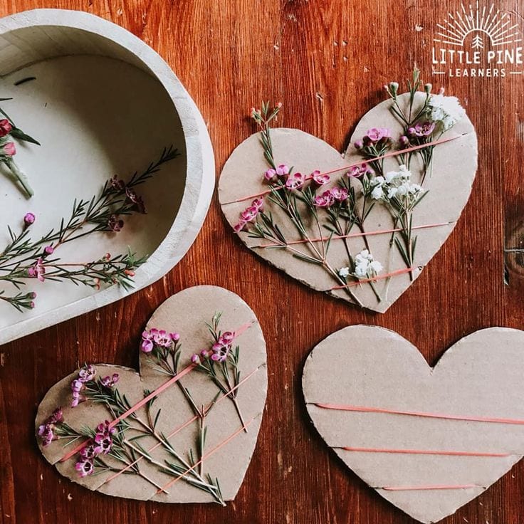 DIY Valentines kid-friendly craft idea featuring botanical organic heart-shaped cards wuth pressed florals