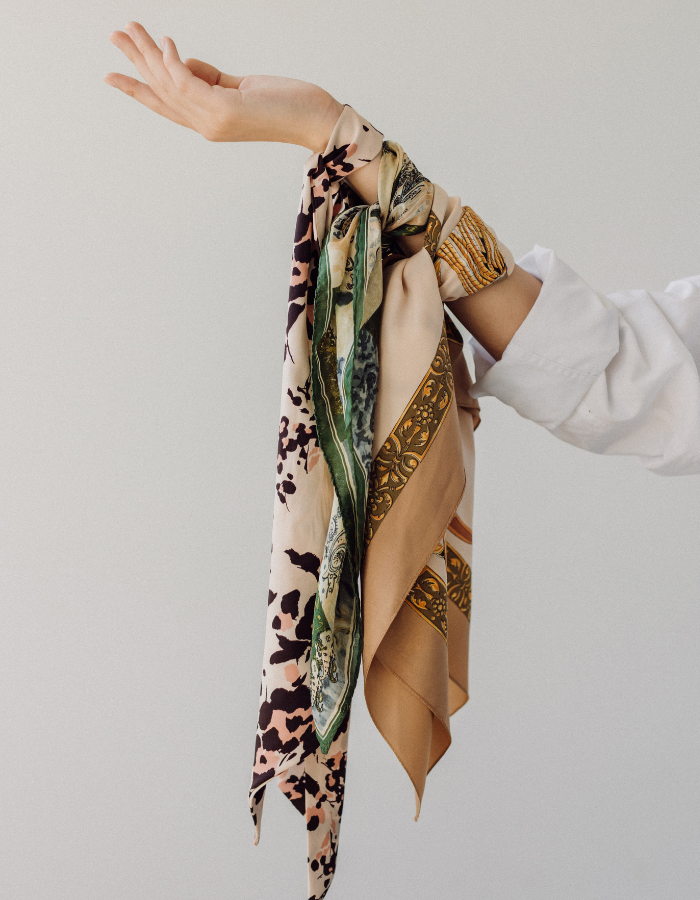 woman's arm holding scarves shown as example of Valentine's day gift ideas for her