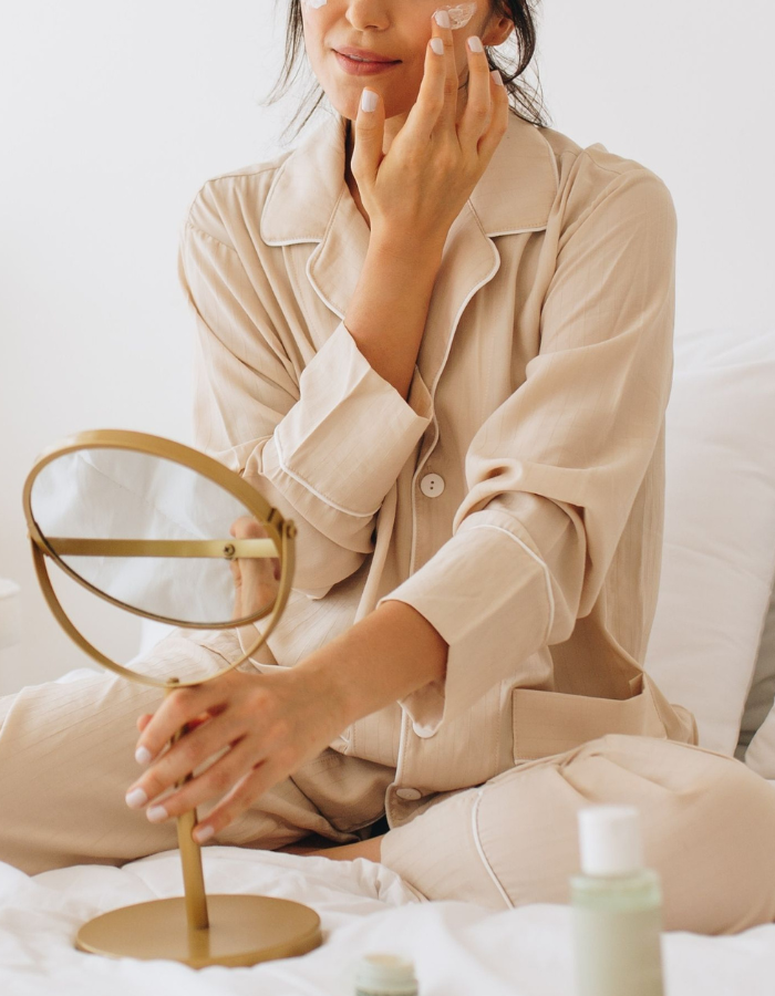 image of woman applying beauty products as example of Valentine's day gift ideas for her