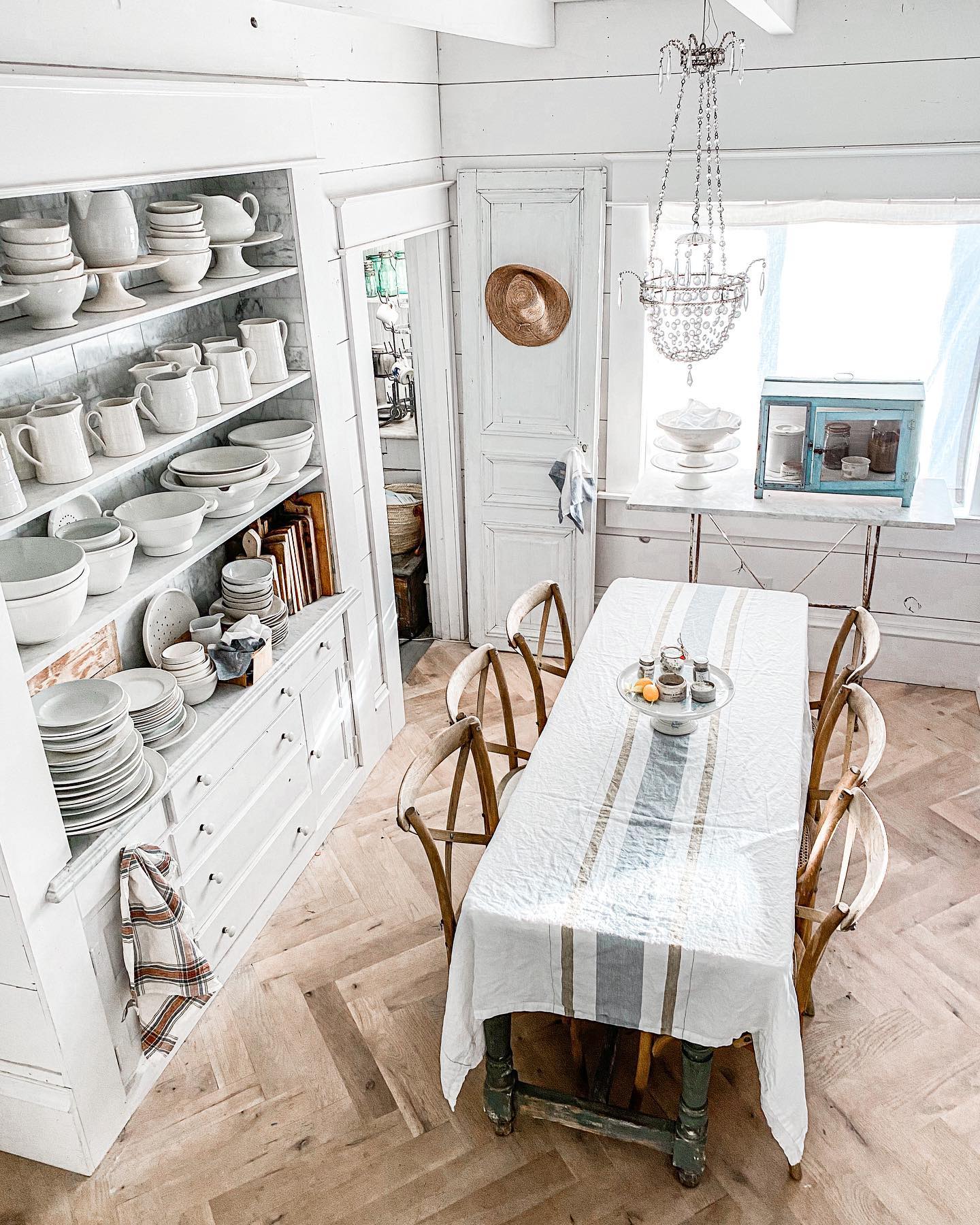 Example of French kitchen style decor featuring a kitchen with contemporary and traditional furniture