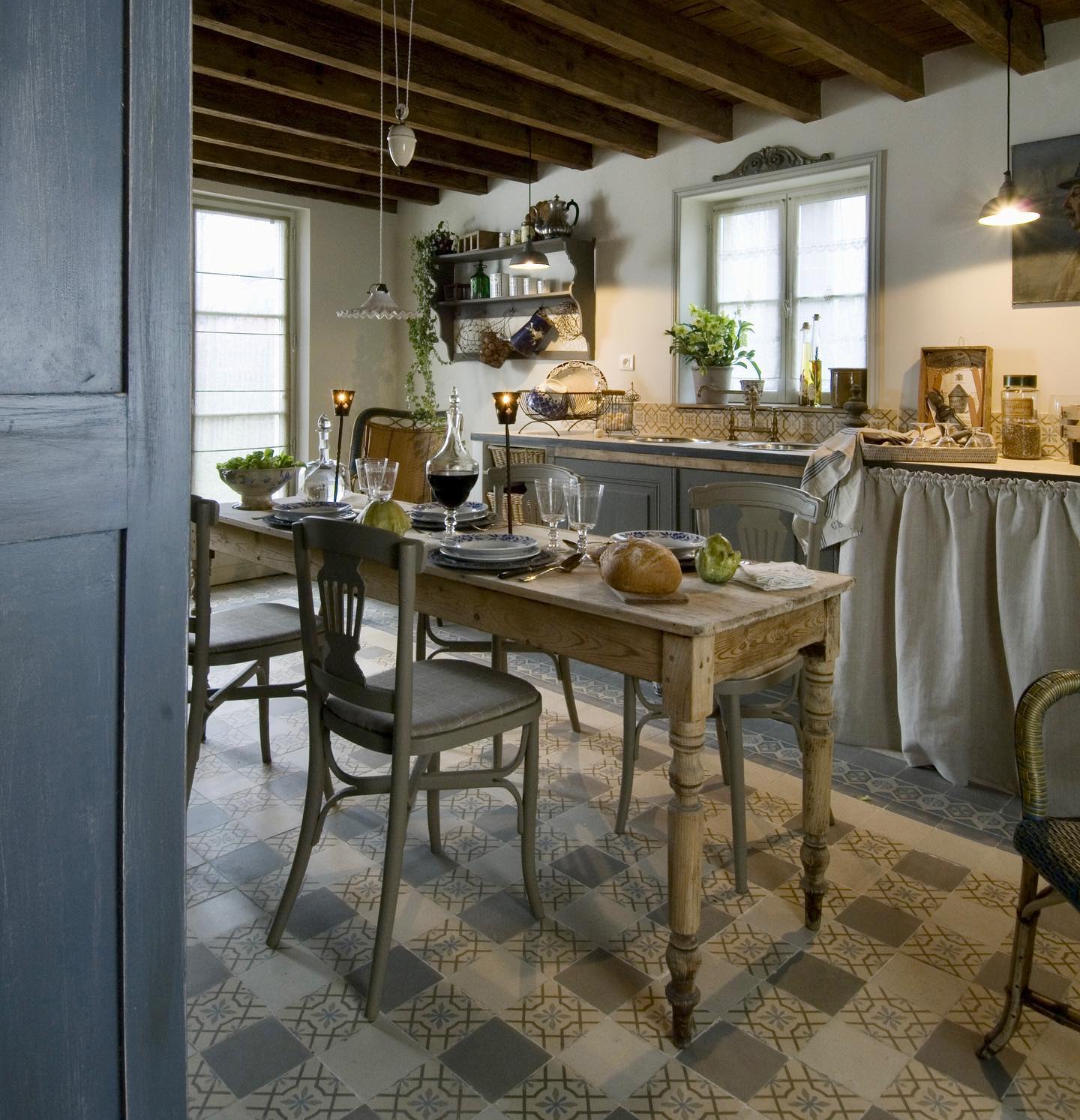 Example of French kitchen style decor featuring a kitchen with rustic touches