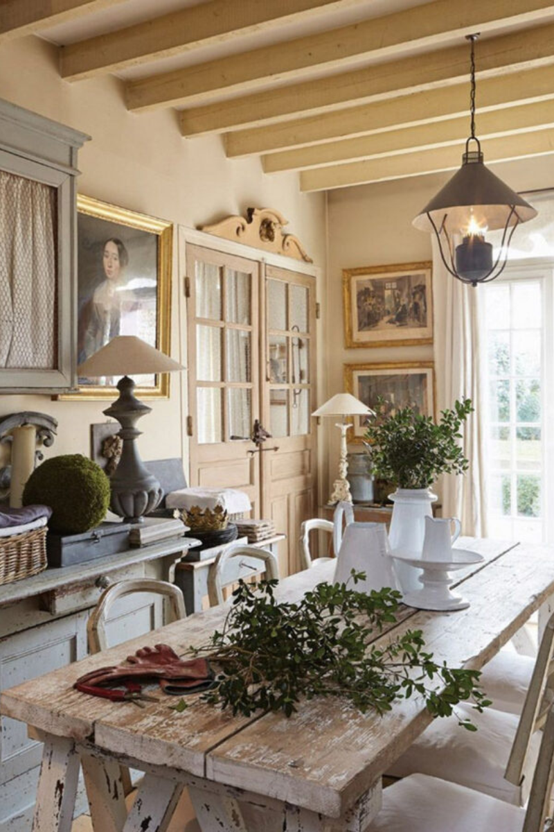 Example of French kitchen style decor featuring a kitchen with contemporary and traditional furniture