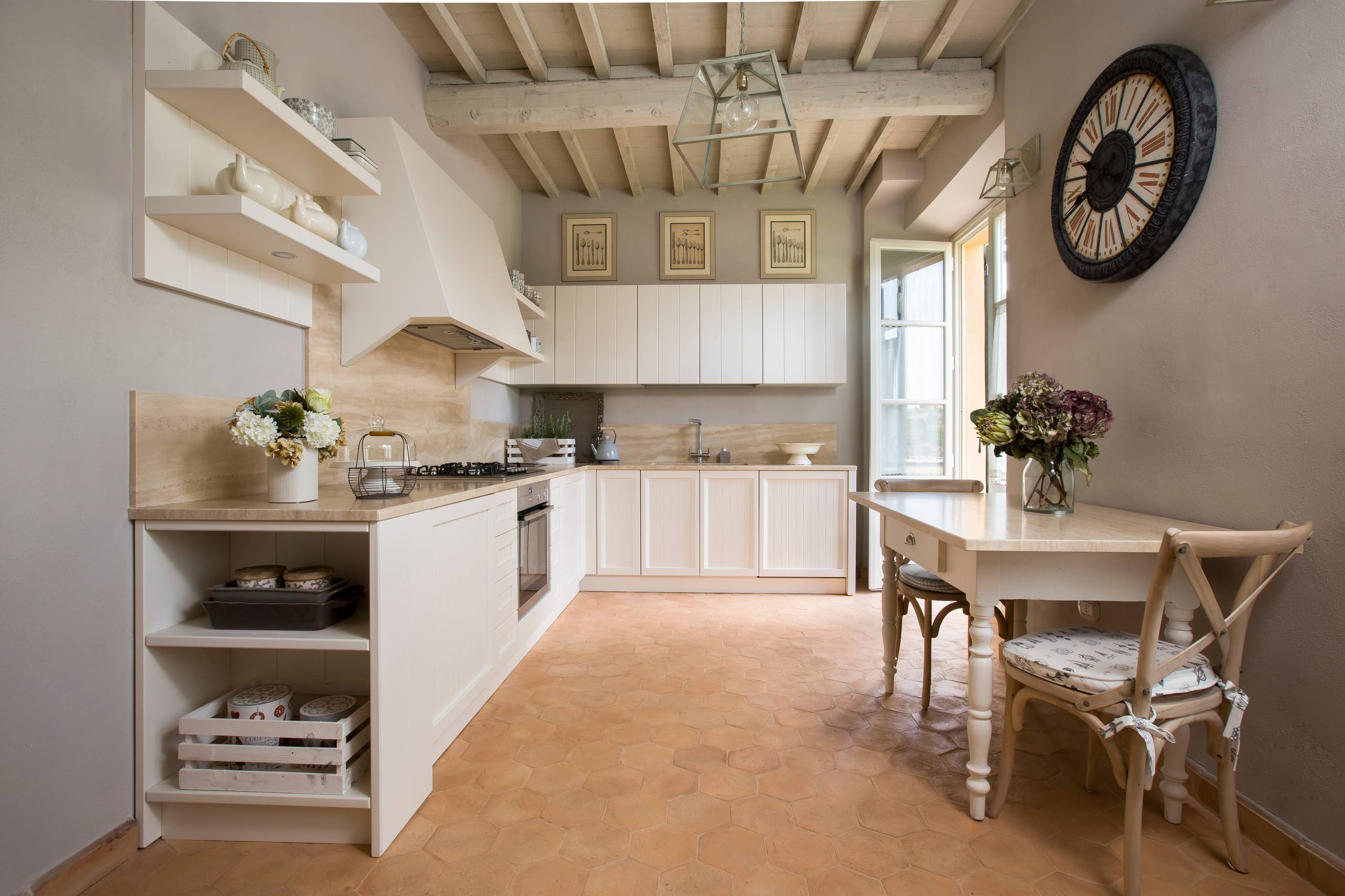 Example of French kitchen style decor featuring a kitchen with contemporary and traditional furniture