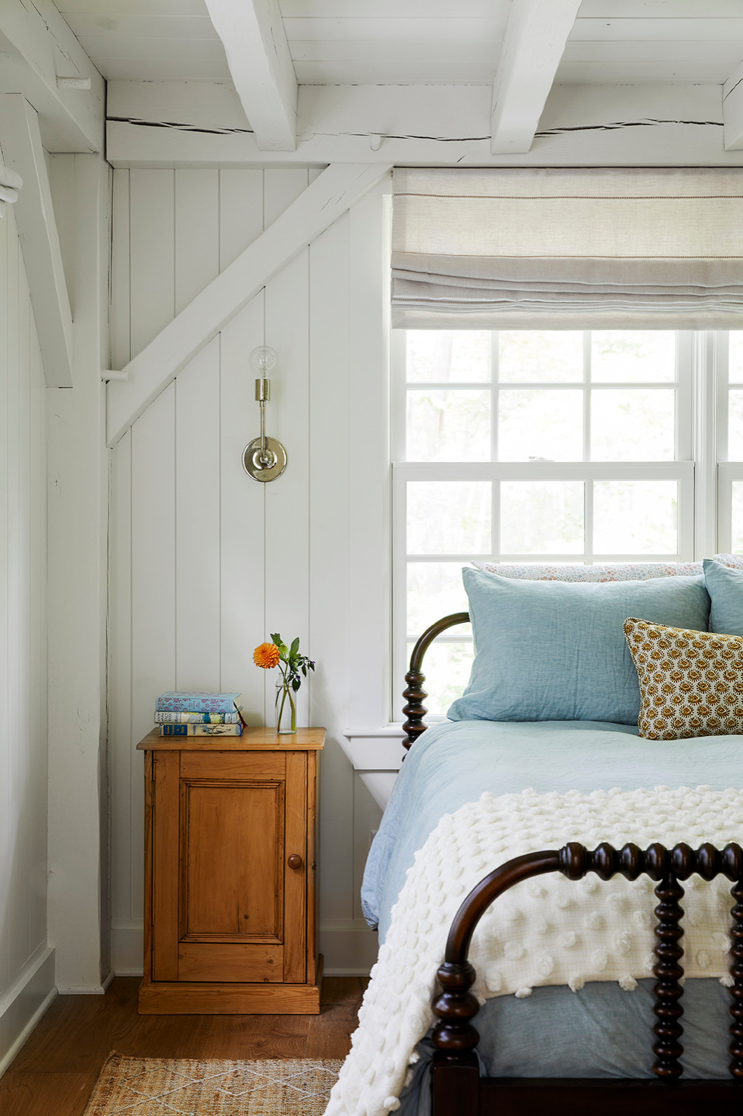 Vintage style furniture example of traditional coastal bedroom