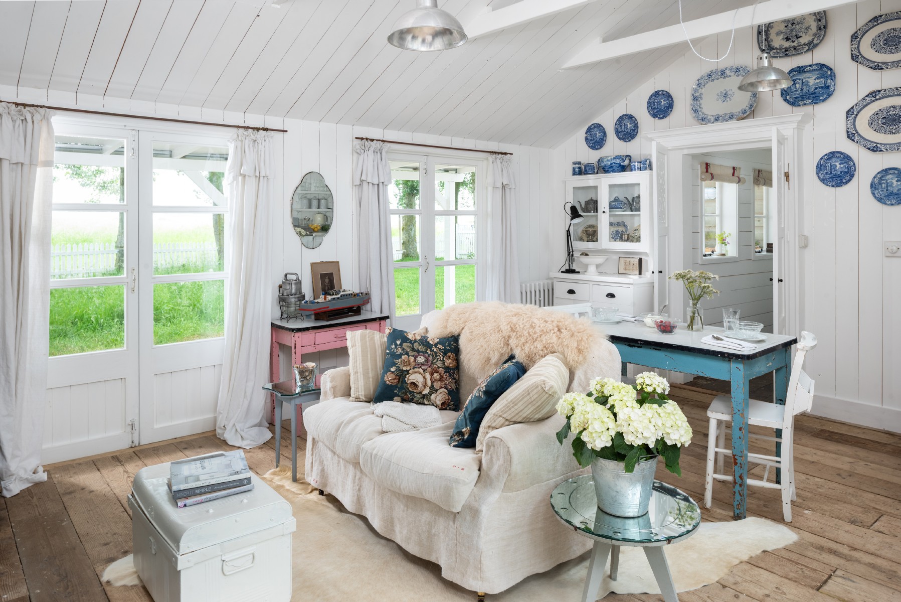 Vintage style furniture example of eclectic coastal living room