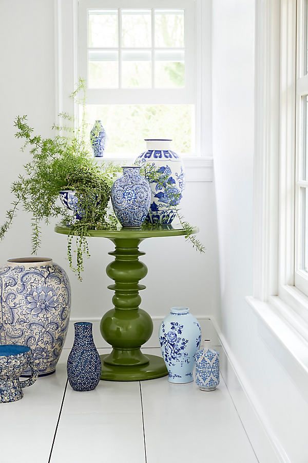 Eastern entryway table decor idea featuring a chinoiserie vases