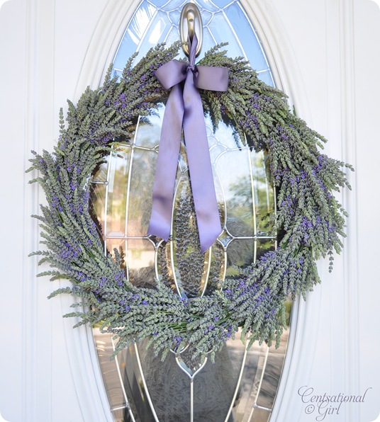 spring wreath for your front door idea featuring a neutral option with lavander flowers and purple ribbon