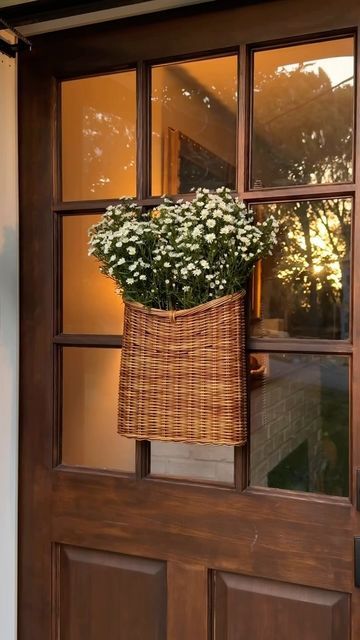 spring wreath for your front door idea featuring basket wreath with silvery greenery and white flowers