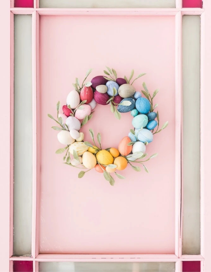 spring wreath for your front door idea featuring colorful paper easter eggs