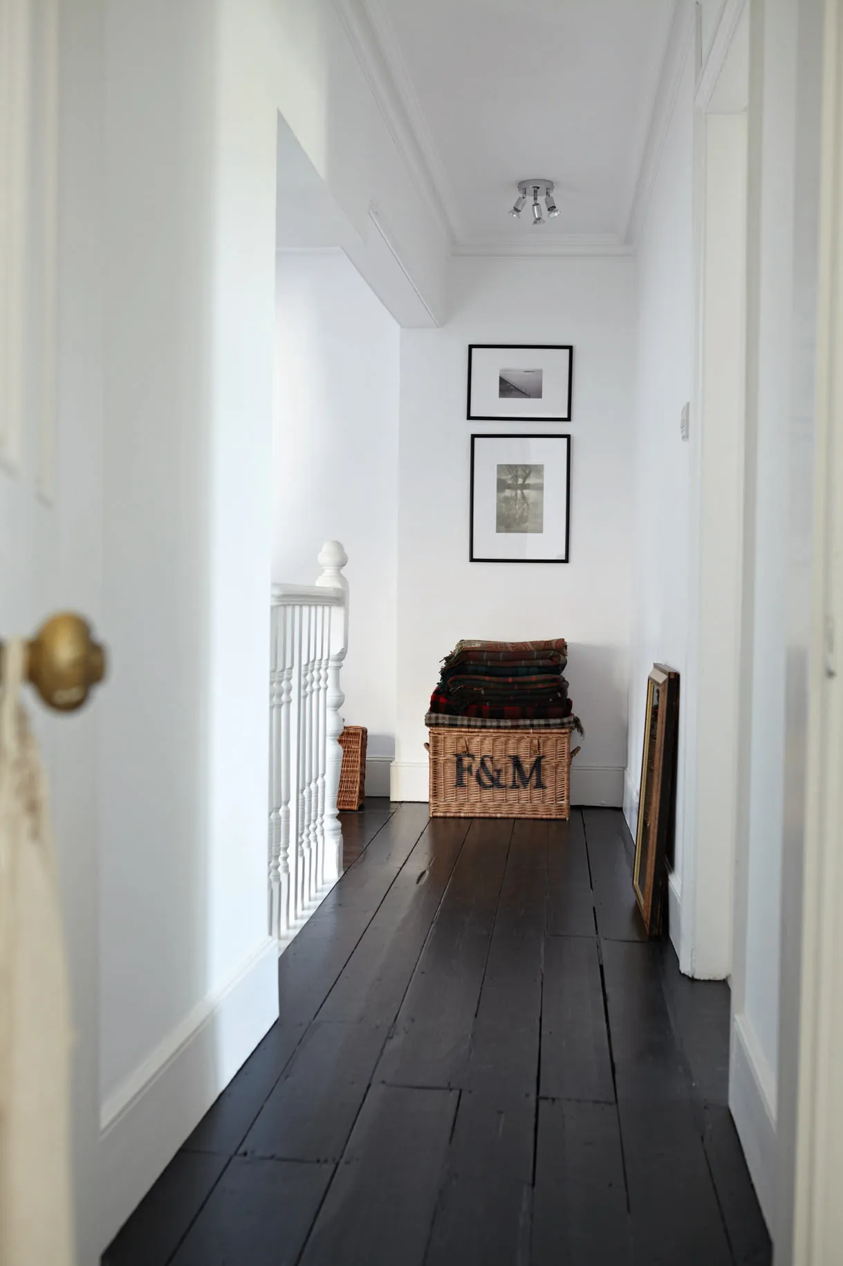 Brunette flooring example featuring a contemporary traditional hallway