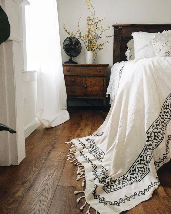 Brunette flooring example featuring a contemporary traditional bedroom