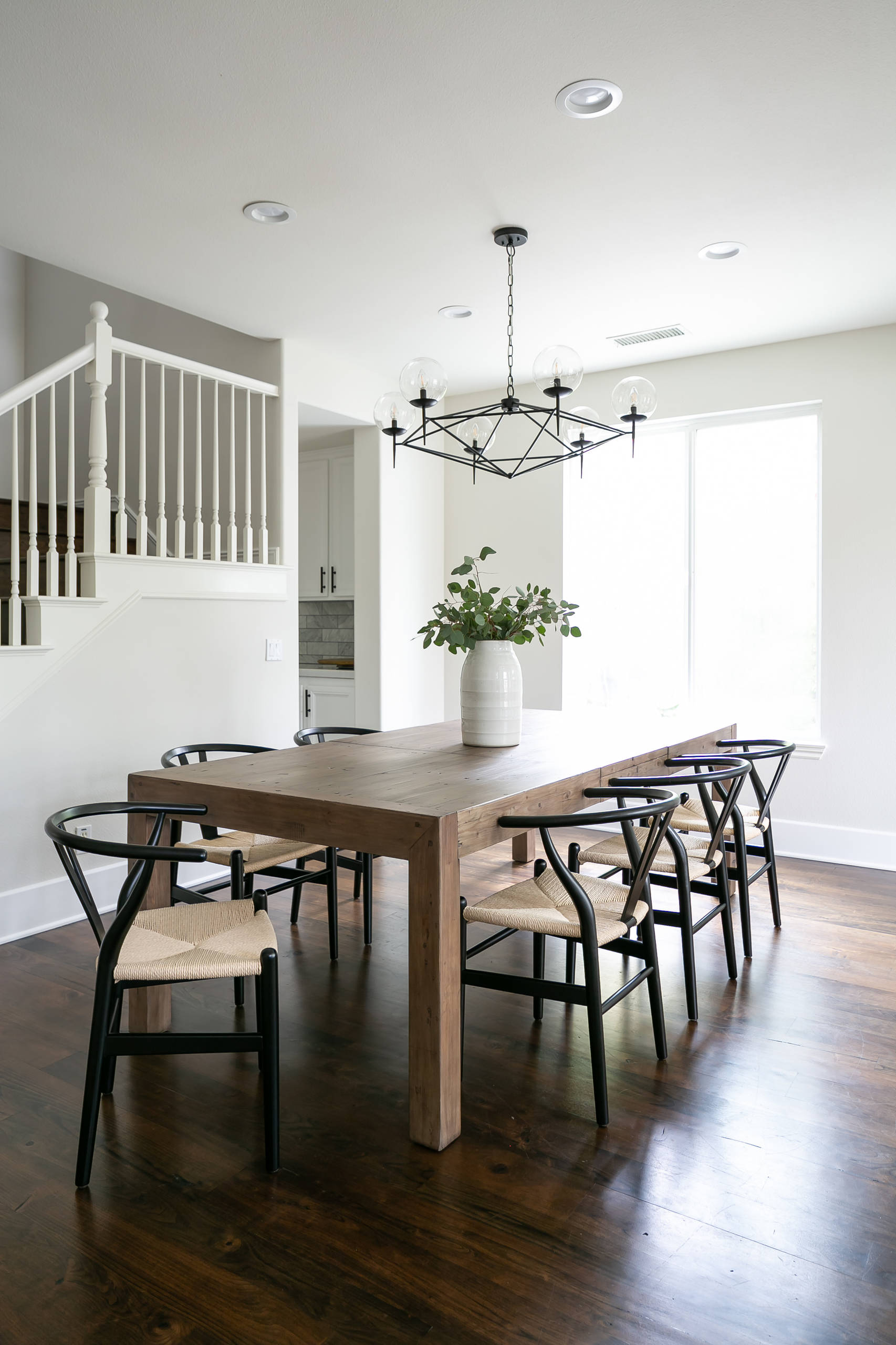 Brunette flooring example featuring a contemporary dining room
