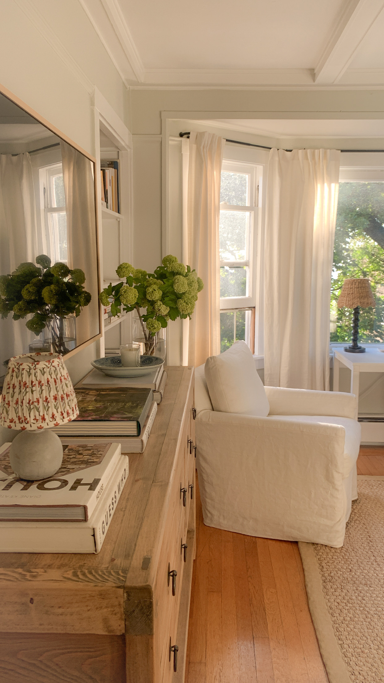 Nancy Meyers interiors inspiration example showcasing a traditional living room with comforting layered decor