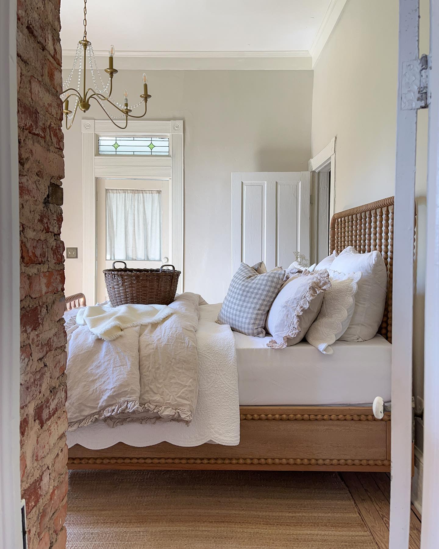 Nancy Meyers interiors inspiration example showcasing a traditional bedroom with comforting layered decor