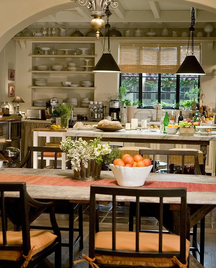 Nancy Meyers interiors inspiration example showcasing a traditional kitchen with comforting layered decor. Set image of the kitchen in the movie "It's Complicated"