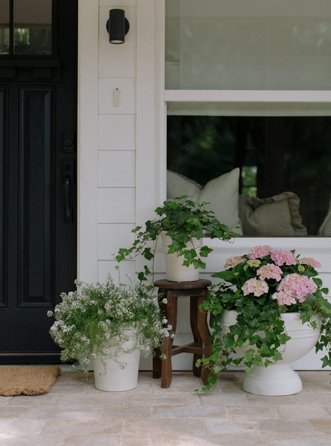 Spring front porch ideas featuring a traditional airy style example