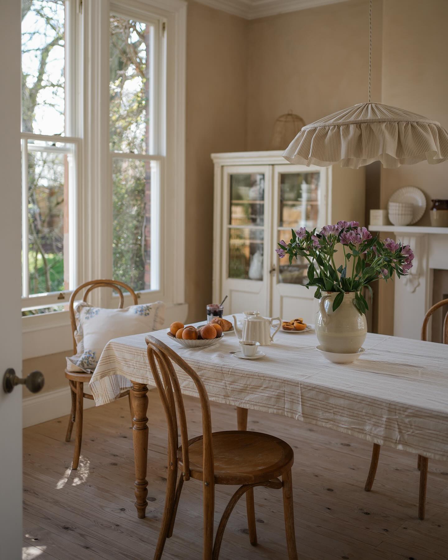 Example of warm rich neutrals color palette in dining room kitchen idea