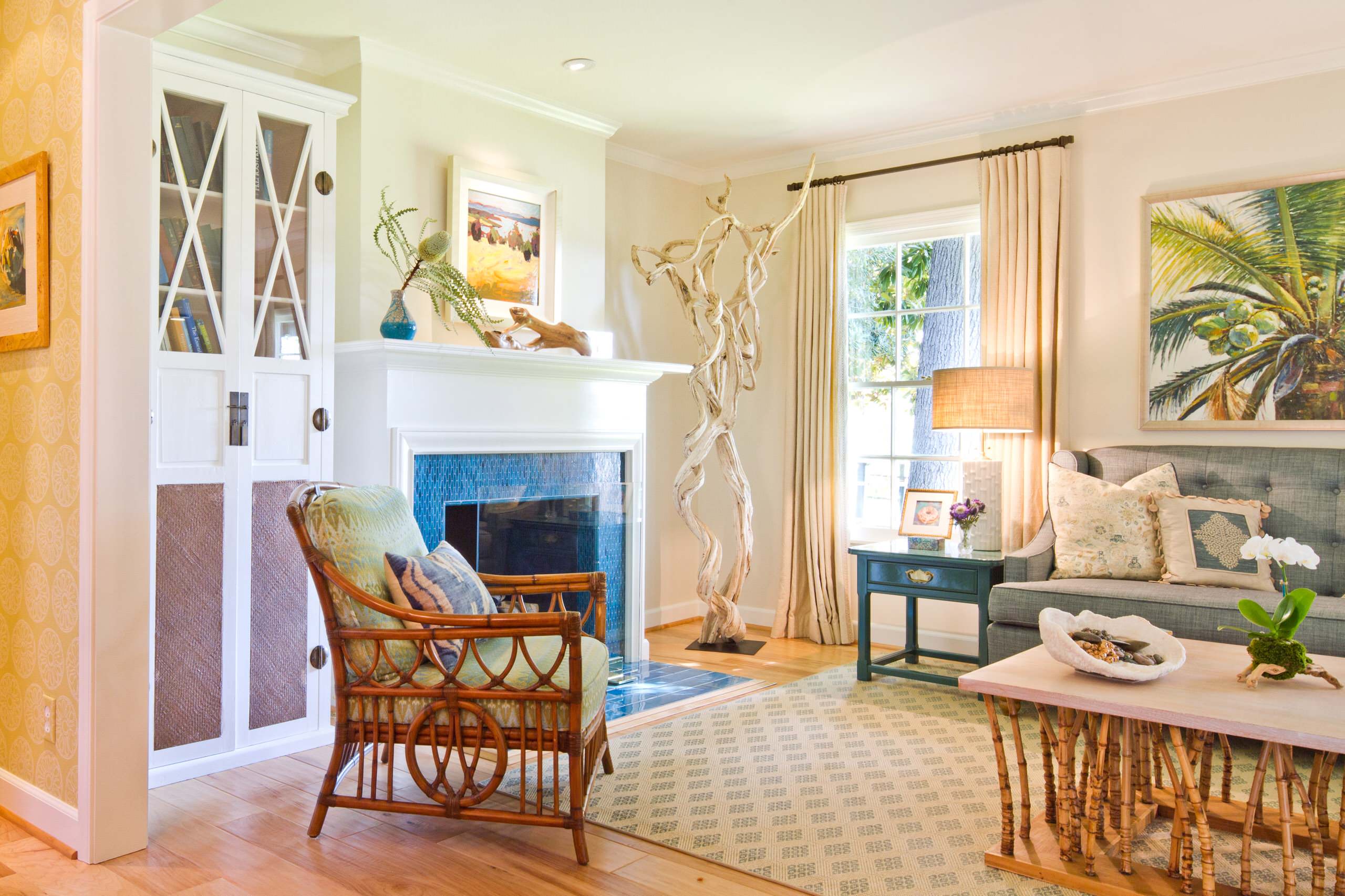 Statement pieces used as unique artworks in this coastal living room featuring acoastal sculpture